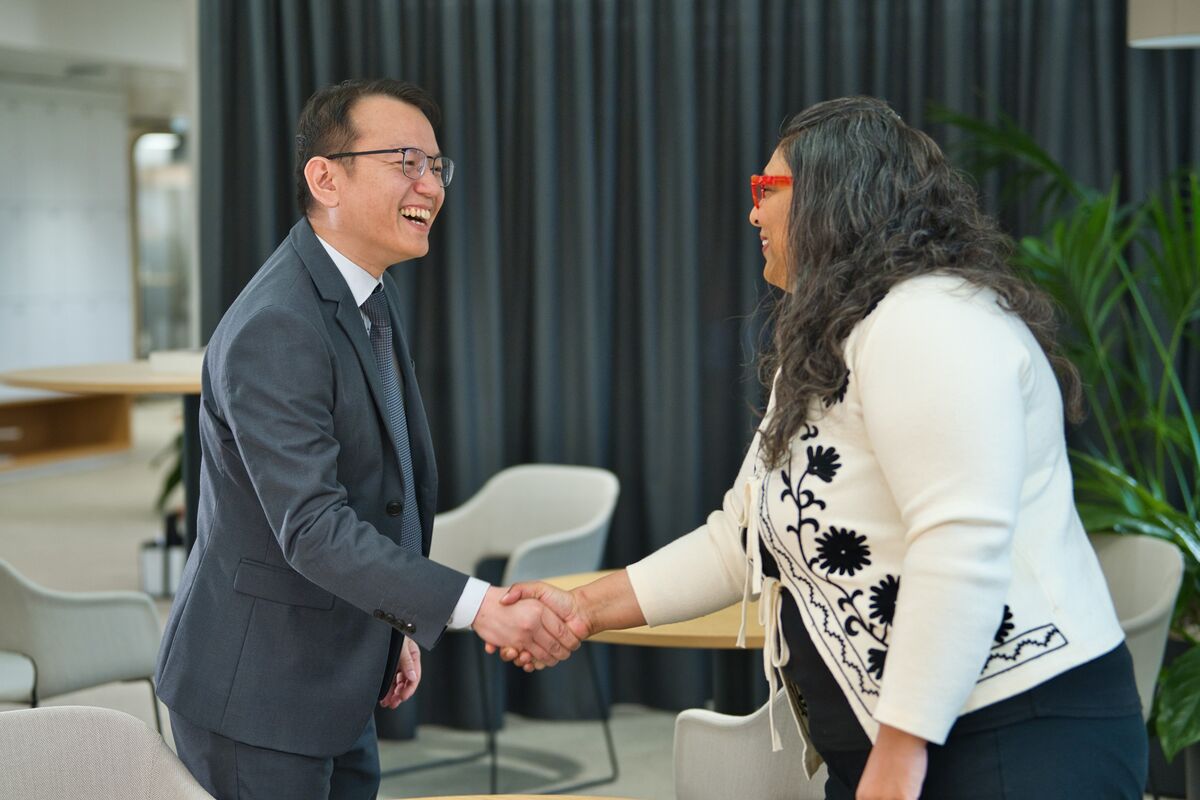 A man and a woman shaking hands