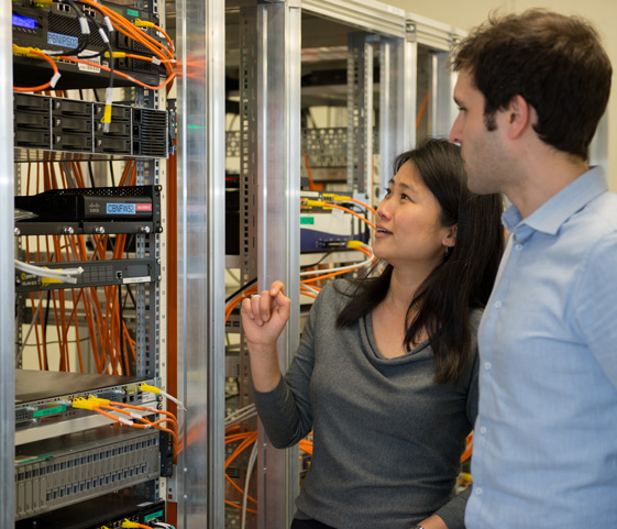 Two people looking at tech hardware