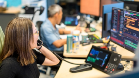 Traders in front of their desk