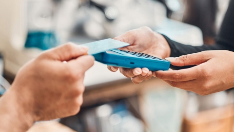 Person using a card for payment