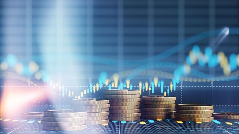 Stacked coins with a graph background