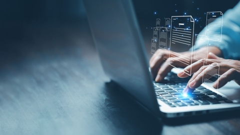 Person typing on a laptop