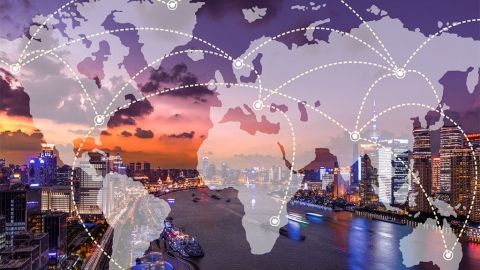 World map overlayed on top of a city scape