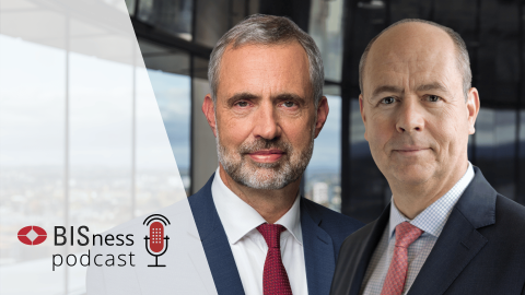 Frank Smets and Gaston Gelos with BISness podcast branding